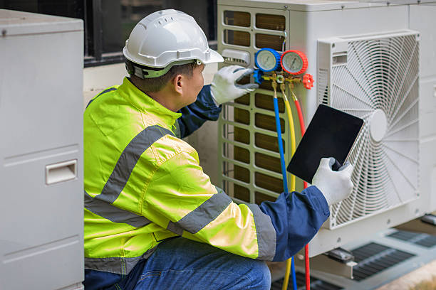 Professional Air Conditioning Repair technician working in Fultonham, NY
